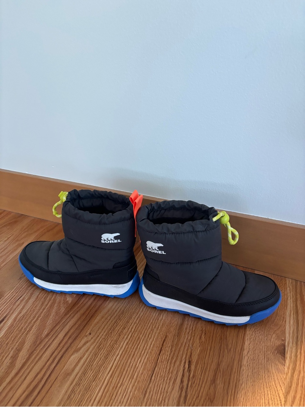 Sorel Kids Black Puffer Winter Boots with Blue Sole